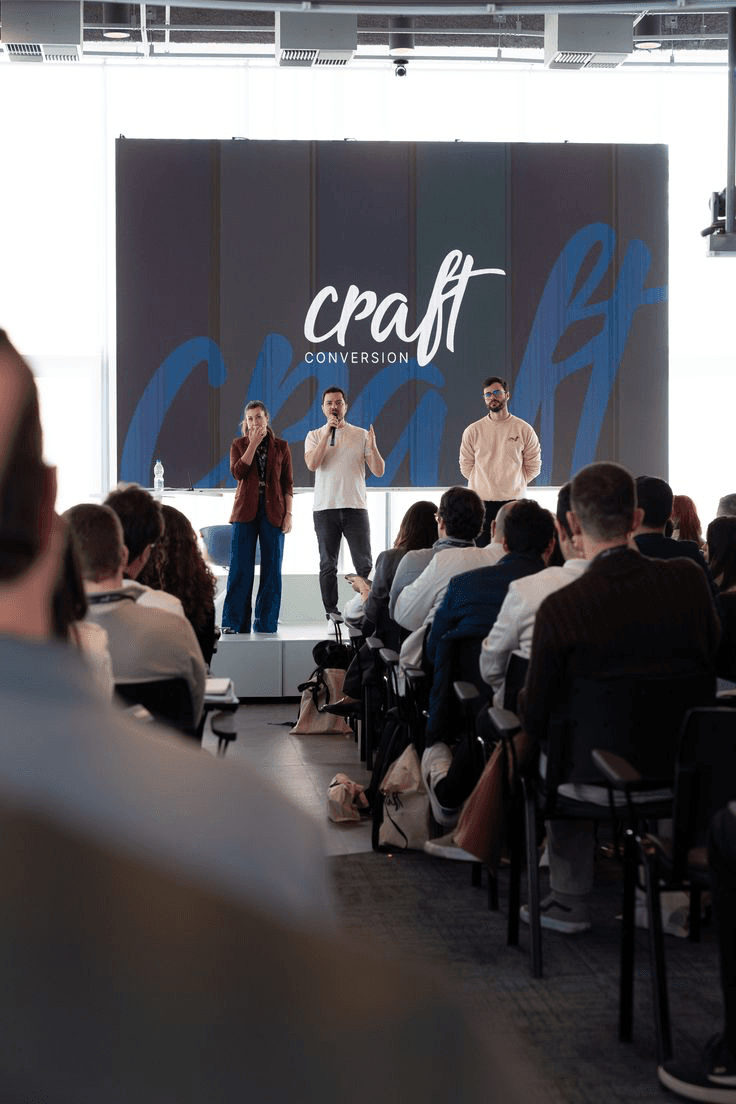 Founders presenting on stage at a craft event.