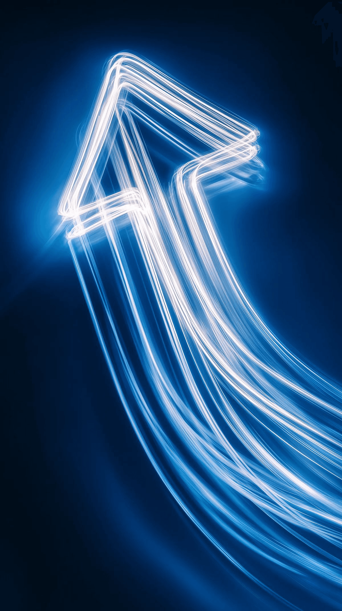 Neon arrow light painting on a dark background.