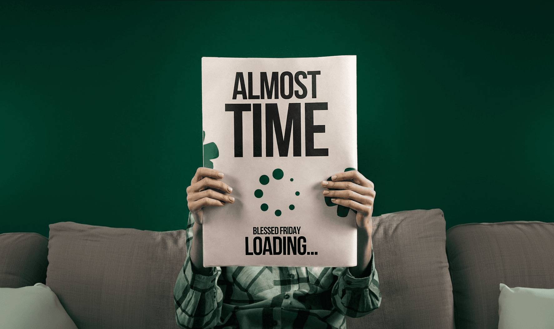 Founder holding up a printed poster that reads "Almost Time" in front of the Startup Accelerator logo.